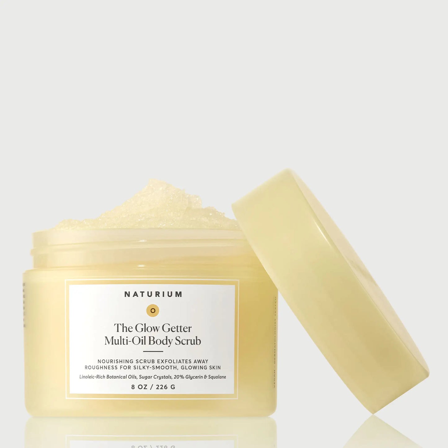 the-glow-getter-multi-oil-body-scrub-o9 NATR-40028-GlowGetter-Multi-Oil-Body-Scrub-Front-CapOff-bonebkgd.webp
